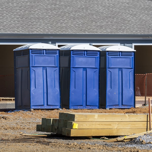 what is the cost difference between standard and deluxe portable restroom rentals in Ball